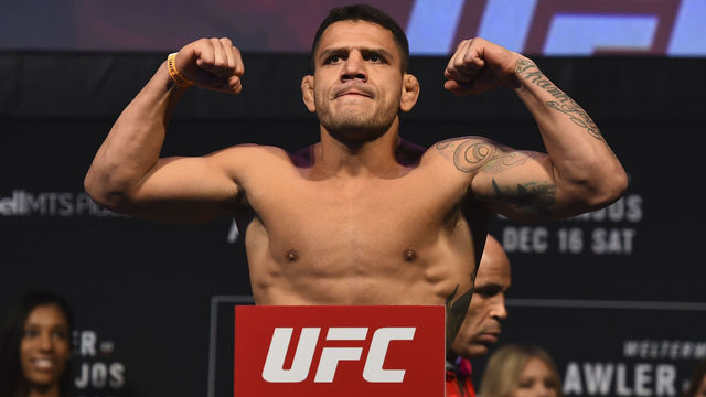 WINNIPEG, CANADA - DECEMBER 15: Rafael Dos Anjos of Brazil poses on the scale during the UFC Fight Night weigh-in on December 15, 2017 in Winnipeg, Canada.