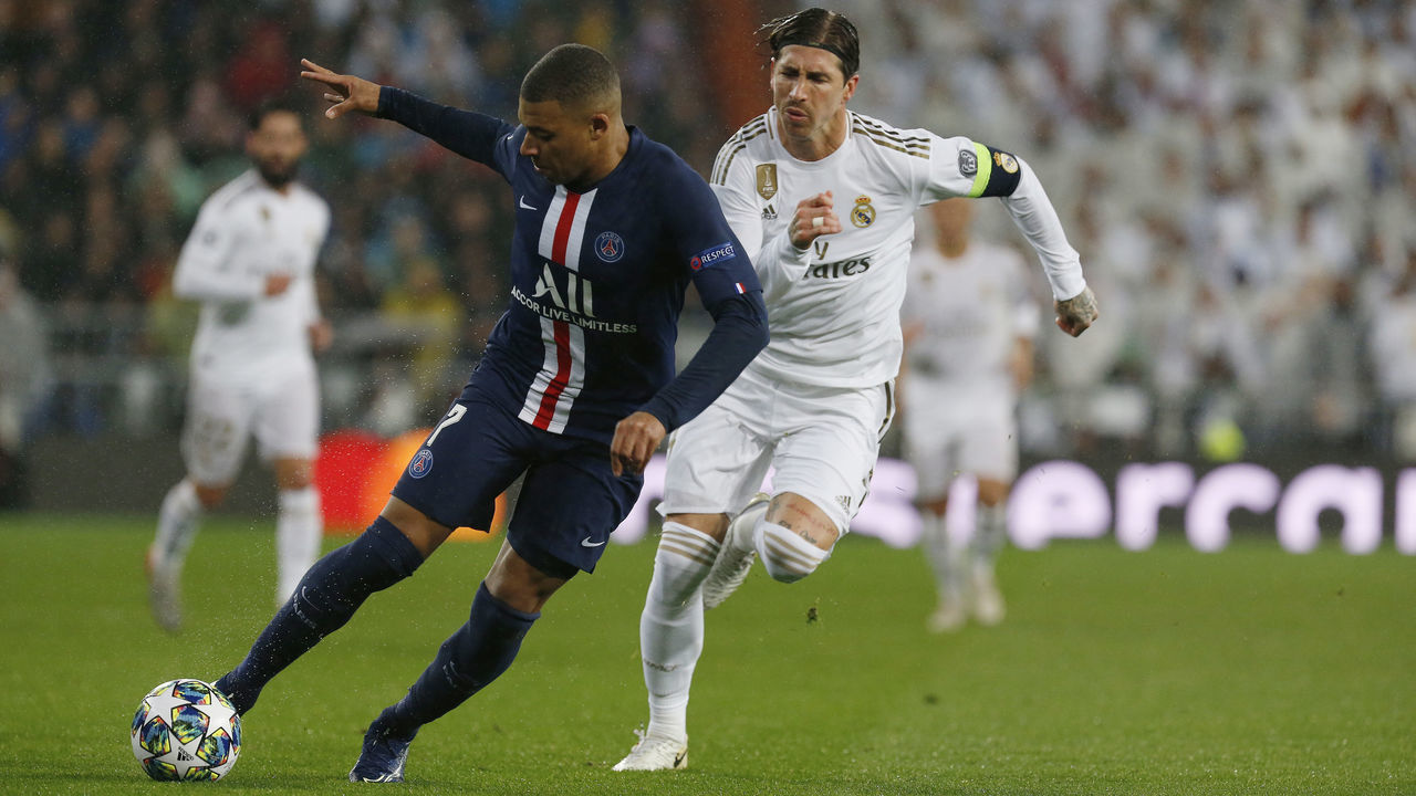 MADRID, SPAIN - 2019/11/26: Kylian Mbappe of PSG and Real Madrid CF's Sergio Ramos are seen in action during the UEFA Champions League match, between Real Madrid and Paris Saint Germain at Santiago Bernabeu Stadium in Madrid. (Final score; Real Madrid 2:2 Paris Saint Germain).