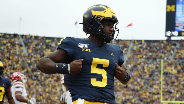 ANN ARBOR, MICHIGAN - SEPTEMBER 28: Joe Milton #5 of the Michigan Wolverines scores a fourth quarter touchdown while playing the Rutgers Scarlet Knights at Michigan Stadium on September 28, 2019 in Ann Arbor, Michigan.