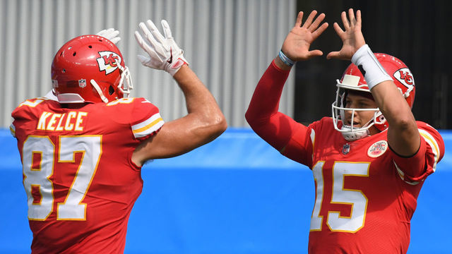 INGLEWOOD, CALIFORNIA - SEPTEMBER 20: Quarterback Patrick Mahomes #15 of the Kansas City Chiefs celebrates a touchdown by teammate tight end Travis Kelce #87 against the Los Angeles Chargers during the second quarter at SoFi Stadium on September 20, 2020 in Inglewood, California.