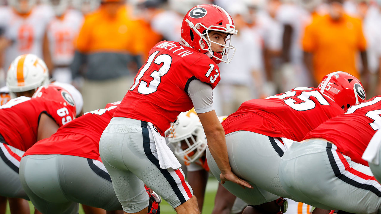 ATHENS, GEORGIA - OCTOBER 10: Stetson Bennett #13 of the Georgia Bulldogs runs the offense against the Tennessee Volunteers during the first half at Sanford Stadium on October 10, 2020 in Athens, Georgia.
