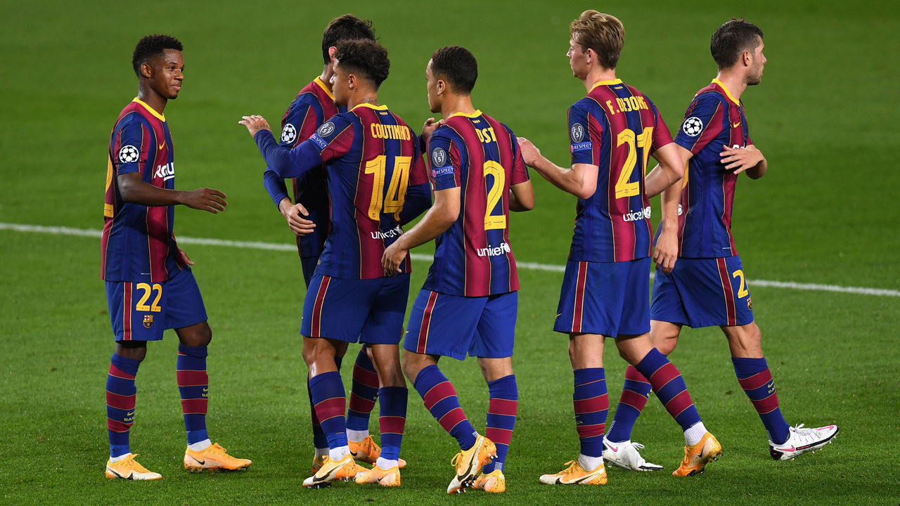 BARCELONA, SPAIN - OCTOBER 20: Ansu Fati of FC Barcelona celebrates with teammates after scoring his sides second goal during the UEFA Champions League Group G stage match between FC Barcelona and Ferencvaros Budapest at Camp Nou on October 20, 2020 in Barcelona, Spain. Sporting stadiums around Europe remain under strict restrictions due to the Coronavirus Pandemic as Government social distancing laws prohibit fans inside venues resulting in games being played behind closed doors.
