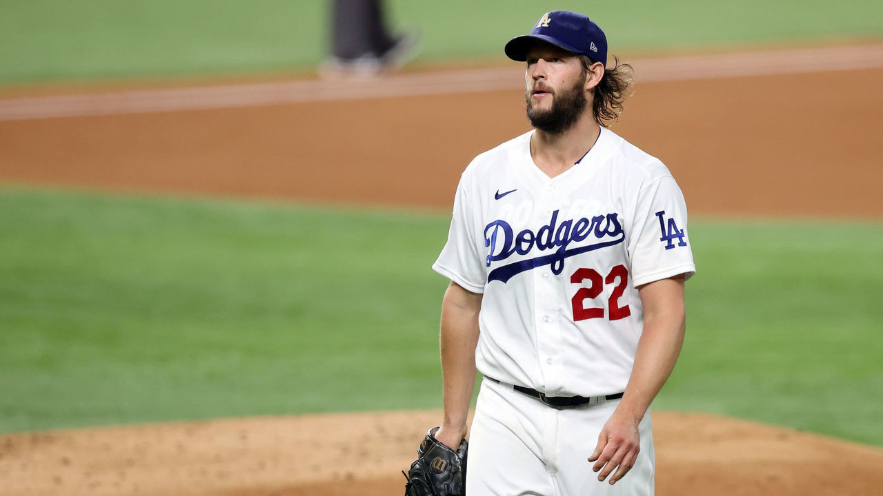 ARLINGTON, TEXAS - OCTOBER 20: Clayton Kershaw #22 of the Los Angeles Dodgers walks back to the dugout after retiring the side against the Tampa Bay Rays during the second inning in Game One of the 2020 MLB World Series at Globe Life Park on October 20, 2020 in Arlington, Texas.