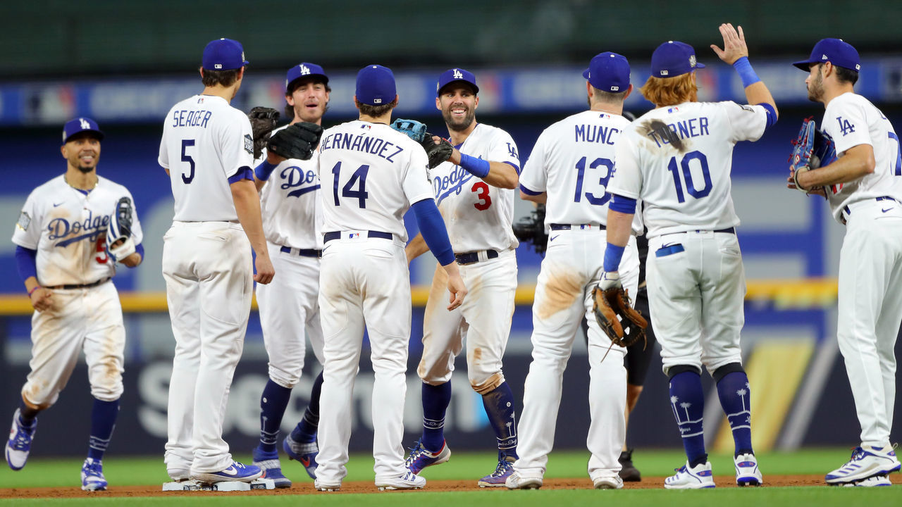 ARLINGTON, TX - OCTOBER 20: Mookie Betts #50, Corey Seager #5, Cody Bellinger #35, Enrique Hernandez #14, Chris Taylor #3, Max Muncy #13, Justin Turner #10 and Joe Kelly #17 of the Los Angeles Dodger celebrate after winning Game 1 of the 2020 World Series between the Los Angeles Dodgers and the Tampa Bay Rays at Globe Life Field on Tuesday, October 20, 2020 in Arlington, Texas.