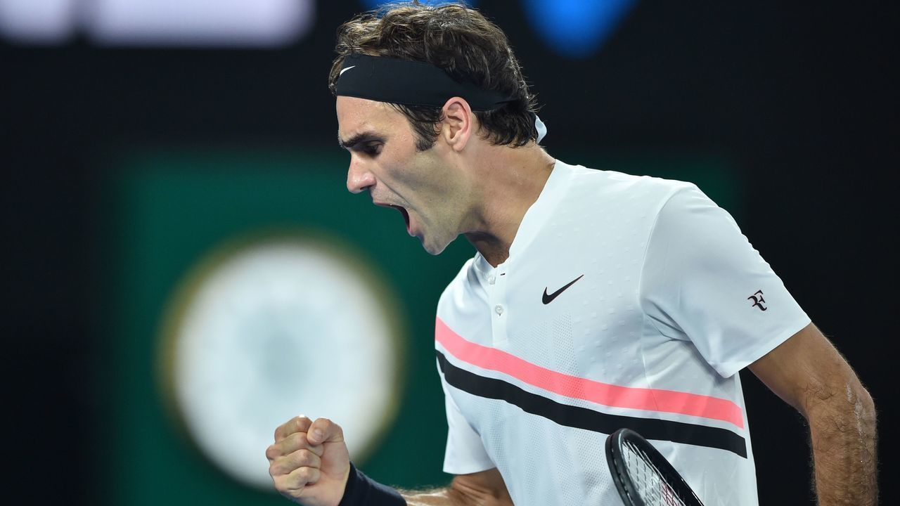 Switzerland's Roger Federer reacts after a point against Croatia's Marin Cilic during their men's singles final match on day 14 of the Australian Open tennis tournament in Melbourne on January 28, 2018. / AFP PHOTO / PETER PARKS / -- IMAGE RESTRICTED TO EDITORIAL USE - STRICTLY NO COMMERCIAL USE --