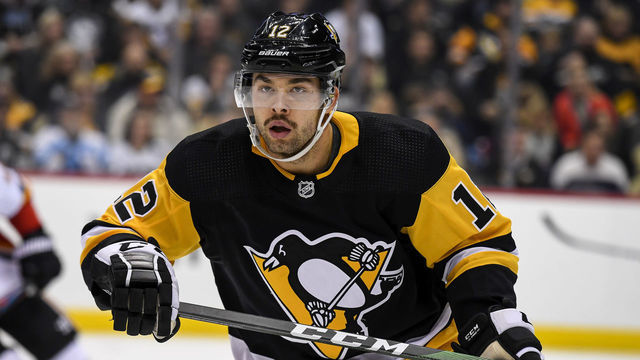PITTSBURGH, PA - NOVEMBER 25: Pittsburgh Penguins Center Dominik Simon (12) looks on during the third period in the NHL game between the Pittsburgh Penguins and the Calgary Flames on November 25, 2019, at PPG Paints Arena in Pittsburgh, PA.