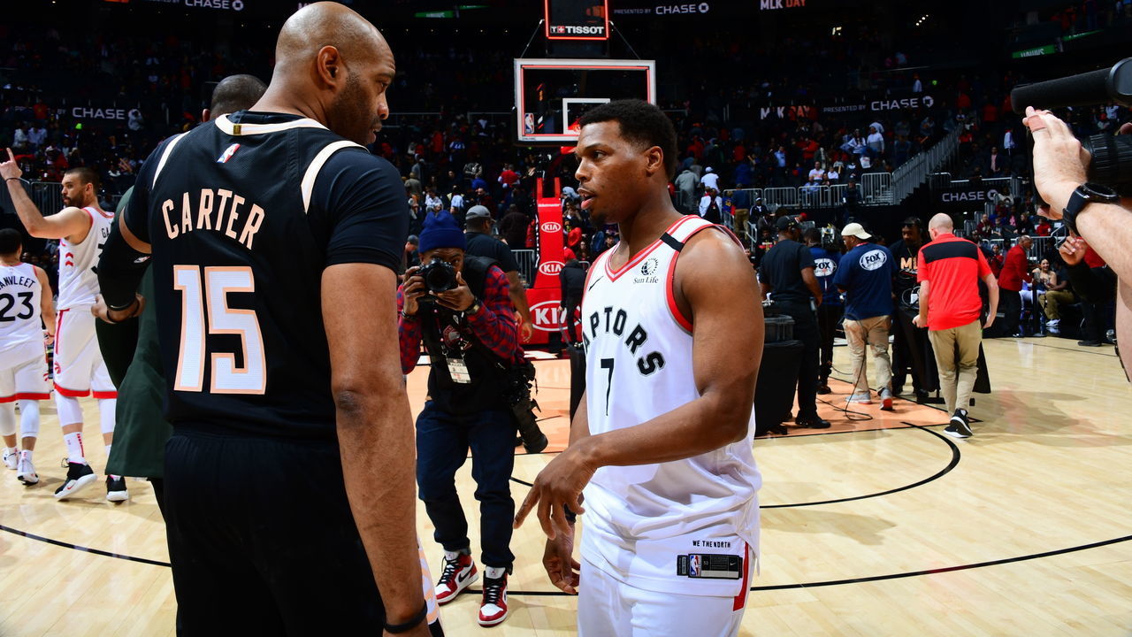 ATLANTA, GA - JANUARY 20: Vince Carter #15 of the Atlanta Hawks and Kyle Lowry #7 of the Toronto Raptors talk after a game on January 20, 2020 at State Farm Arena in Atlanta, Georgia. NOTE TO USER: User expressly acknowledges and agrees that, by downloading and/or using this Photograph, user is consenting to the terms and conditions of the Getty Images License Agreement. Mandatory Copyright Notice: Copyright 2020 NBAE