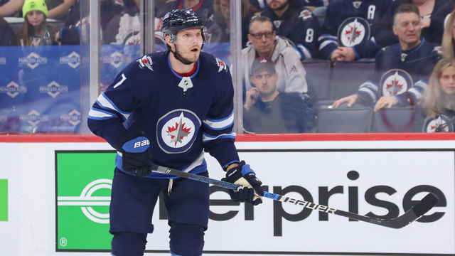 WINNIPEG, MB - FEBRUARY 16: Dmitry Kulikov #7 of the Winnipeg Jets keeps an eye on the play during first period action against the Chicago Blackhawks at the Bell MTS Place on February 16, 2020 in Winnipeg, Manitoba, Canada. The Jets defeated the Hawks 3-2.