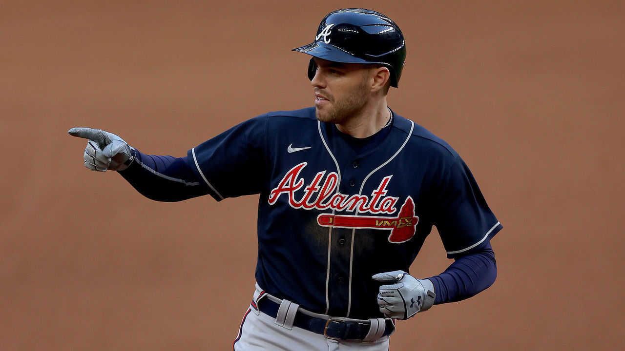 ARLINGTON, TEXAS - OCTOBER 13: Freddie Freeman #5 of the Atlanta Braves hits a two run home run against the Los Angeles Dodgers during the fourth inning in Game Two of the National League Championship Series at Globe Life Field on October 13, 2020 in Arlington, Texas.