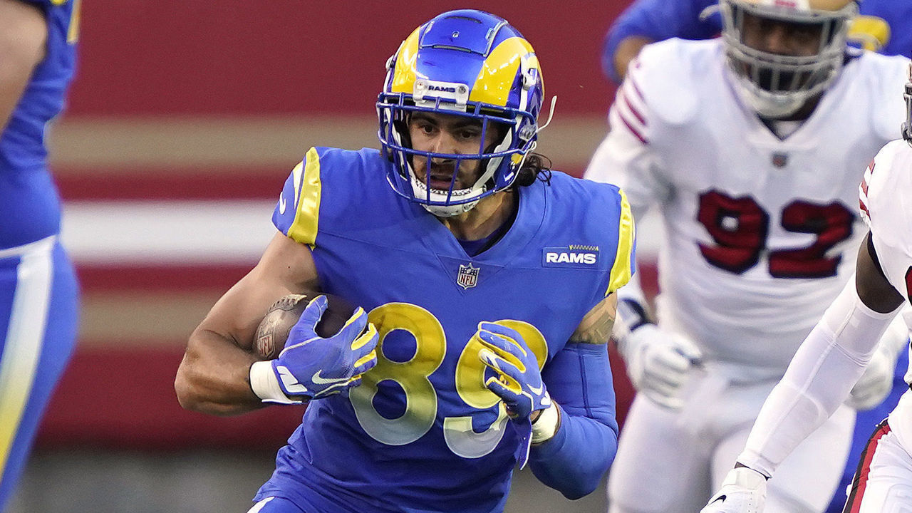 SANTA CLARA, CALIFORNIA - OCTOBER 18: Tyler Higbee #89 of the Los Angeles Rams runs for a first down against Jaquiski Tartt #29 of the San Francisco 49ers during the first quarter at Levi's Stadium on October 18, 2020 in Santa Clara, California.