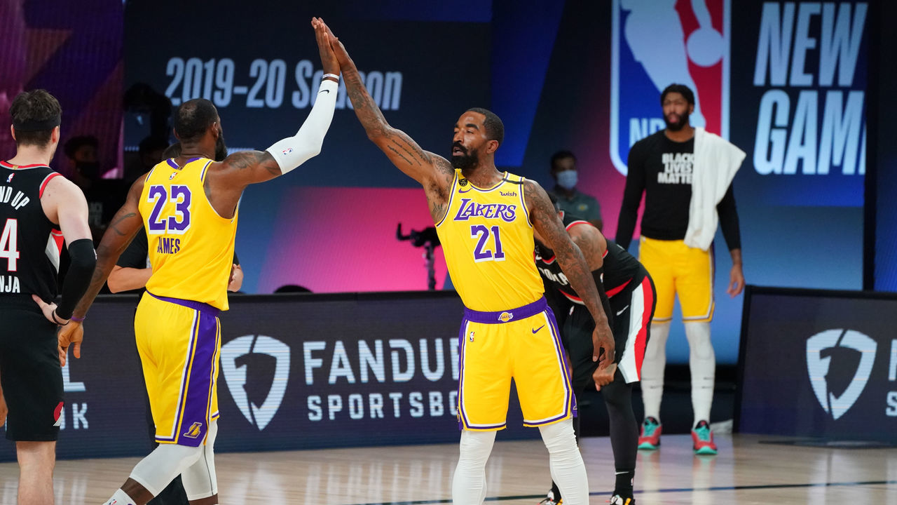 ORLANDO, FL - AUGUST 29: LeBron James #23 of the Los Angeles Lakers and J.R. Smith #21 of the Los Angeles Lakers high-five during a game against the Portland Trail Blazers during Round One, Game Five of the NBA Playoffs on August 29, 2020 at the AdventHealth Arena at ESPN Wide World Of Sports Complex in Orlando, Florida. NOTE TO USER: User expressly acknowledges and agrees that, by downloading and/or using this Photograph, user is consenting to the terms and conditions of the Getty Images License Agreement. Mandatory Copyright Notice: Copyright 2020 NBAE