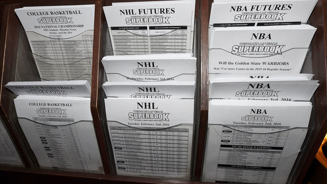 LAS VEGAS, NV - FEBRUARY 02: Betting sheets for NBA, NHL and NCAA basketball are stacked at the Race & Sports SuperBook at the Westgate Las Vegas Resort & Casino on February 2, 2016 in Las Vegas, Nevada. The newly renovated sports book, currently offering nearly 400 proposition bets for Super Bowl 50 between the Carolina Panthers and the Denver Broncos, has the world's largest indoor LED video wall with 4,488 square feet of HD video screens measuring 240 feet wide and 20 feet tall.