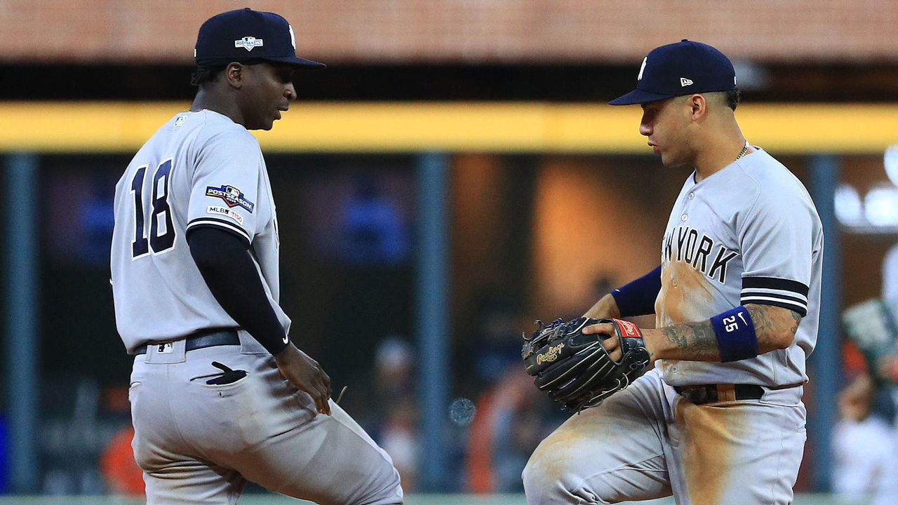 HOUSTON, TEXAS - OCTOBER 12: Didi Gregorius #18 and Gleyber Torres #25 of the New York Yankees celebrate their teams 7-0 win over the Houston Astros in game one of the American League Championship Series at Minute Maid Park on October 12, 2019 in Houston, Texas.