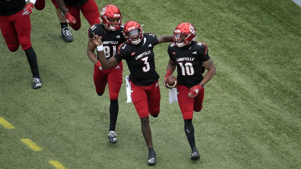 LOUISVILLE, KENTUCKY - OCTOBER 24: Malik Cunningham #3 of the Louisville Cardinals celebrates after throwing a touchdown pass to Javian Hawkins #10 against the Florida State Seminoles at Cardinal Stadium on October 24, 2020 in Louisville, Kentucky.