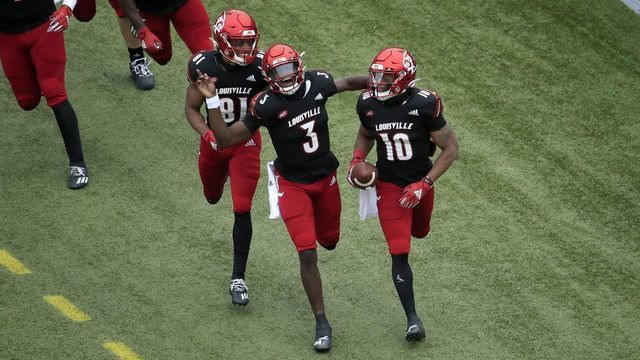 LOUISVILLE, KENTUCKY - OCTOBER 24: Malik Cunningham #3 of the Louisville Cardinals celebrates after throwing a touchdown pass to Javian Hawkins #10 against the Florida State Seminoles at Cardinal Stadium on October 24, 2020 in Louisville, Kentucky.