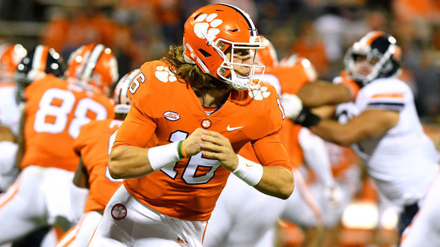 CLEMSON, SC - OCTOBER 03: Clemson Tigers quarterback Trevor Lawrence (16) fakes rolling out with the ball during the game between the Clemson Tigers and the Virginia Cavaliers on October 03, 2020 at Memorial Stadium in Clemson, South Carolina.