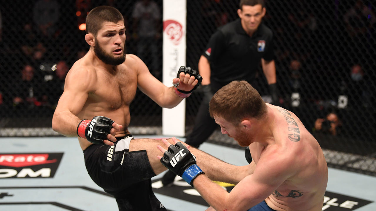 ABU DHABI, UNITED ARAB EMIRATES - OCTOBER 25: (L-R) Khabib Nurmagomedov of Russia kicks Justin Gaethje in their lightweight title bout during the UFC 254 event on October 25, 2020 on UFC Fight Island, Abu Dhabi, United Arab Emirates.