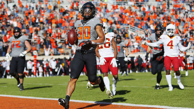 STILLWATER, OK - OCTOBER 24: Running back Chuba Hubbard #30 of the Oklahoma State Cowboys crosses the goal line after breaking free for a 32-yard touchdown against the Iowa State Cyclones in the second quarter at Boone Pickens Stadium on October 24, 2020 in Stillwater, Oklahoma.