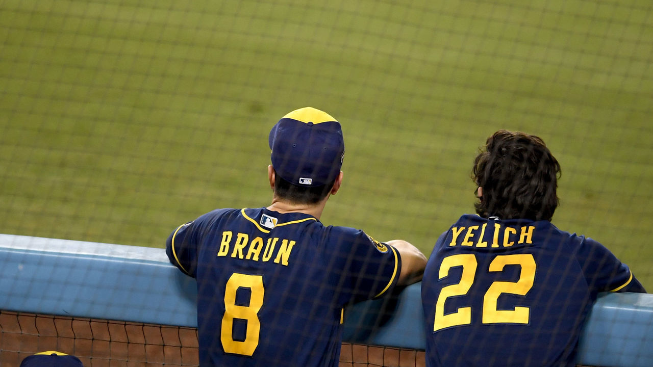 LOS ANGELES, CA - OCTOBER 01: Ryan Braun #8 of the Milwaukee Brewers along with teammate Christian Yelich #22 look on against the Los Angeles Dodgers in the eighth inning of Game 2 of a National League wild-card baseball series MLB baseball game at Dodger Stadium in Los Angeles on Thursday, October 1, 2020.