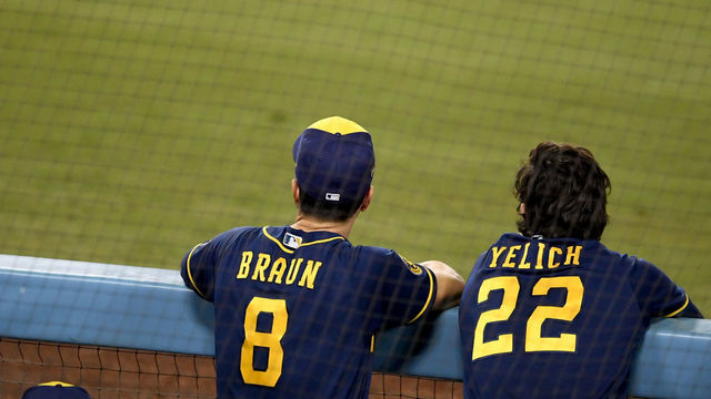 LOS ANGELES, CA - OCTOBER 01: Ryan Braun #8 of the Milwaukee Brewers along with teammate Christian Yelich #22 look on against the Los Angeles Dodgers in the eighth inning of Game 2 of a National League wild-card baseball series MLB baseball game at Dodger Stadium in Los Angeles on Thursday, October 1, 2020.