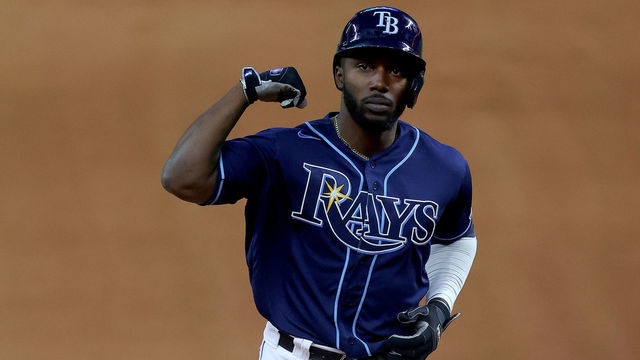 ARLINGTON, TEXAS - OCTOBER 24: Randy Arozarena #56 of the Tampa Bay Rays celebrates after hitting a solo home run against the Los Angeles Dodgers during the fourth inning in Game Four of the 2020 MLB World Series at Globe Life Field on October 24, 2020 in Arlington, Texas.
