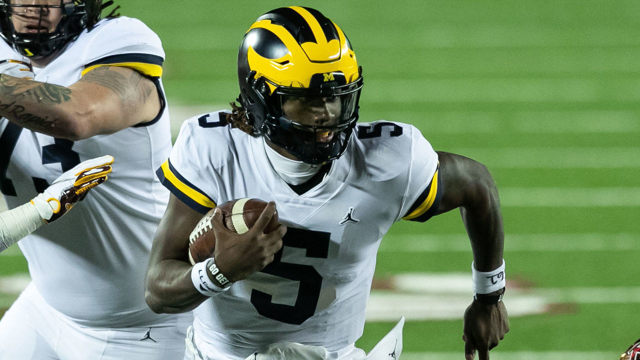 MINNEAPOLIS, MINNESOTA - OCTOBER 24: Joe Milton #5 of the Michigan Wolverines carries the ball against the Minnesota Golden Gophers in the second quarter of the game at TCF Bank Stadium on October 24, 2020 in Minneapolis, Minnesota.