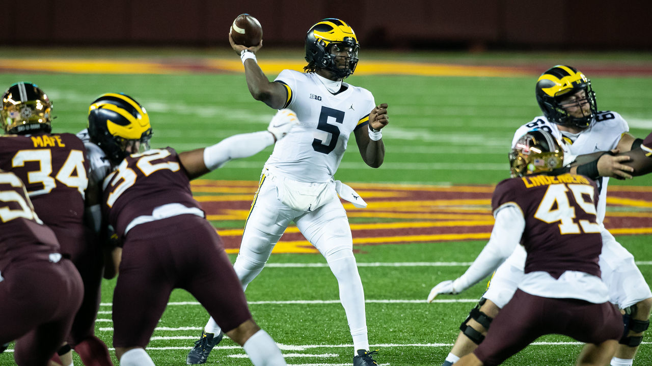 MINNEAPOLIS, MINNESOTA - OCTOBER 24: Joe Milton #5 of the Michigan Wolverines throws a pass against the Minnesota Golden Gophers in the third quarter of the game at TCF Bank Stadium on October 24, 2020 in Minneapolis, Minnesota. The Wolverines defeated the Gophers 49-24.