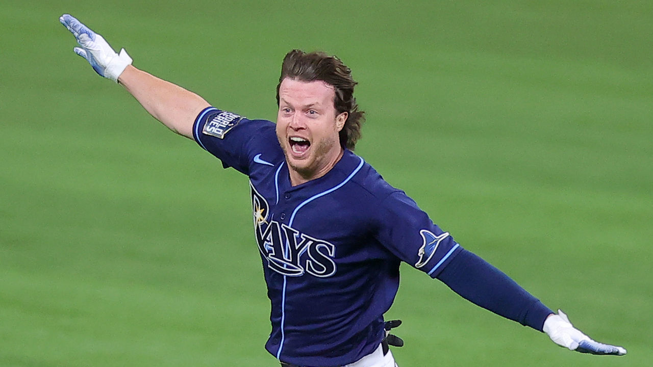 ARLINGTON, TEXAS - OCTOBER 24: Brett Phillips #14 of the Tampa Bay Rays celebrates after hitting a ninth inning two-run walk-off single to defeat the Los Angeles Dodgers 8-7 in Game Four of the 2020 MLB World Series at Globe Life Field on October 24, 2020 in Arlington, Texas.