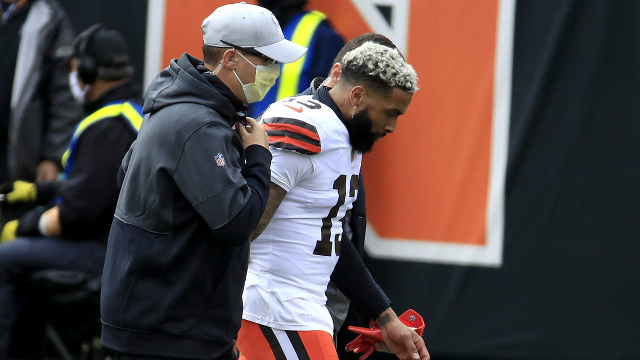 CINCINNATI, OHIO - OCTOBER 25: Odell Beckham Jr. #13 of the Cleveland Browns is helped off the field after against the Cincinnati Bengals during the first half at Paul Brown Stadium on October 25, 2020 in Cincinnati, Ohio.