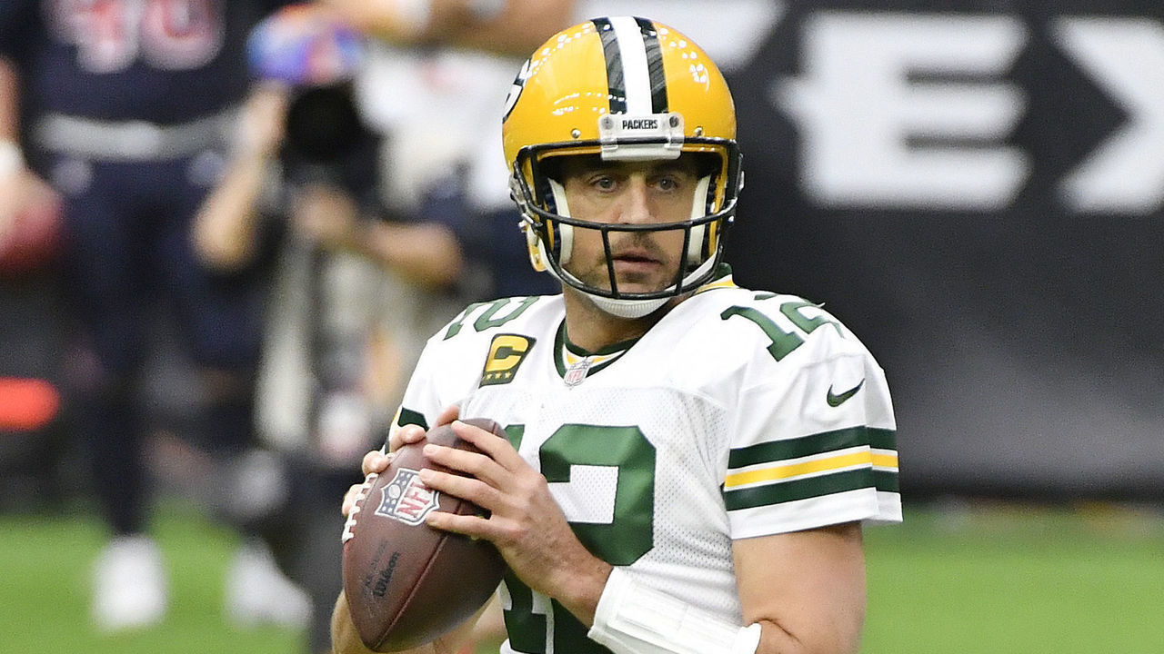 HOUSTON, TEXAS - OCTOBER 25: Aaron Rodgers #12 of the Green Bay Packers looks to pass against the Houston Texans during the first quarter at NRG Stadium on October 25, 2020 in Houston, Texas.