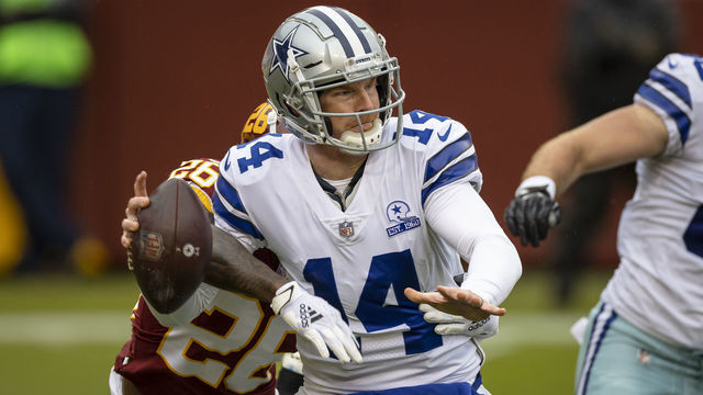 LANDOVER, MD - OCTOBER 25: Landon Collins #26 of the Washington Football Team strips the ball from Andy Dalton #14 of the Dallas Cowboys during the first half at FedExField on October 25, 2020 in Landover, Maryland.