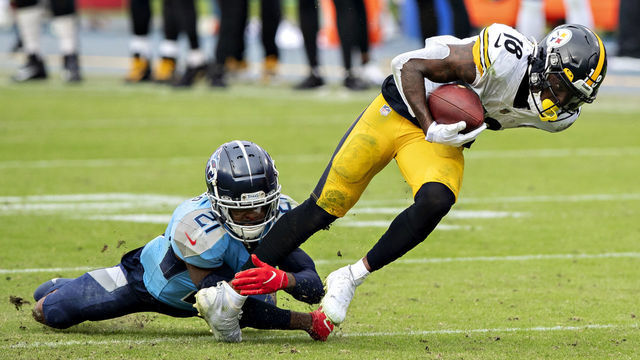 NASHVILLE, TN - OCTOBER 25: Diontae Johnson #18 of the Pittsburgh Steelers is tackled in the second half after catching a pass by Malcolm Butler #21 of the Tennessee Titans at Nissan Stadium on October 25, 2020 in Nashville, Tennessee. The Steelers defeated the Titans 27-24.