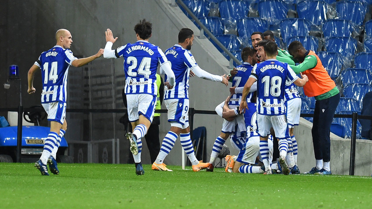 SAN SEBASTIAN, SPAIN - OCTOBER 25: Mikel Oyarzabal of Real Sociedad celebrates with teammates after scoring his team's second goal during the La Liga Santander match between Real Sociedad and SD Huesca at Estadio Anoeta on October 25, 2020 in San Sebastian, Spain. Sporting stadiums around Spain remain under strict restrictions due to the Coronavirus Pandemic as Government social distancing laws prohibit fans inside venues resulting in games being played behind closed doors.