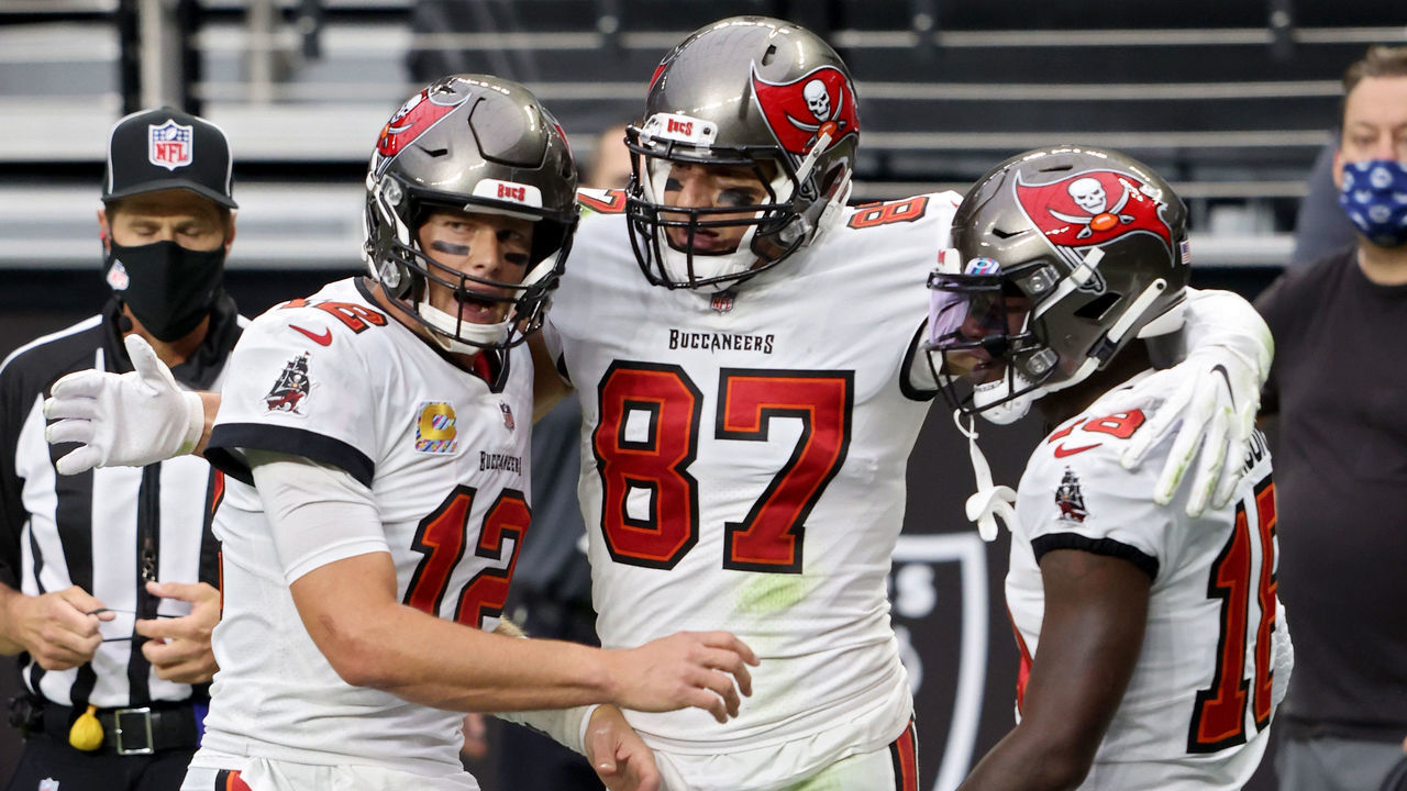 LAS VEGAS, NEVADA - OCTOBER 25: Tom Brady #12, Rob Gronkowski #87, and Tyler Johnson #18 of the Tampa Bay Buccaneers celebrate after scoring a touchdown in the second quarter against the Las Vegas Raiders at Allegiant Stadium on October 25, 2020 in Las Vegas, Nevada.