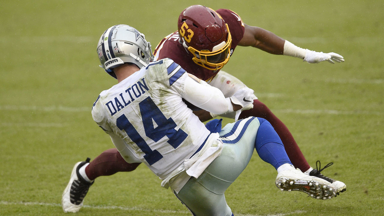 LANDOVER, MARYLAND - OCTOBER 25: Quarterback Andy Dalton #14 of the Dallas Cowboys is hit and injured by Jon Bostic #53 of the Washington Football Team in the third quarter of the game at FedExField on October 25, 2020 in Landover, Maryland.