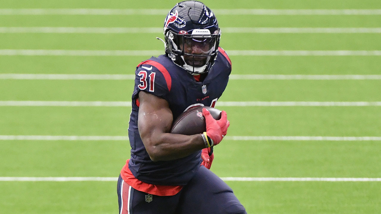 HOUSTON, TEXAS - OCTOBER 25: David Johnson #31 of the Houston Texans runs with the ball against the Green Bay Packers during the third quarter at NRG Stadium on October 25, 2020 in Houston, Texas.