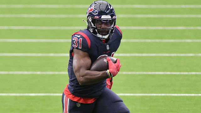 HOUSTON, TEXAS - OCTOBER 25: David Johnson #31 of the Houston Texans runs with the ball against the Green Bay Packers during the third quarter at NRG Stadium on October 25, 2020 in Houston, Texas.