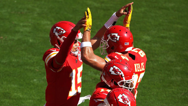 KANSAS CITY, MISSOURI - OCTOBER 11: Patrick Mahomes #15 of the Kansas City Chiefs is congratulated by Travis Kelce #87 after scoring a touchdown against the Las Vegas Raiders during the first quarter at Arrowhead Stadium on October 11, 2020 in Kansas City, Missouri.