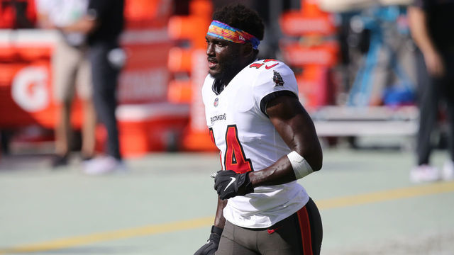 TAMPA, FL - OCTOBER 18: Chris Godwin (14) of the Buccaneers trots off the field after completing warm ups before the regular season game between the Green Bay Packers and the Tampa Bay Buccaneers on October 18, 2020 at Raymond James Stadium in Tampa, Florida.
