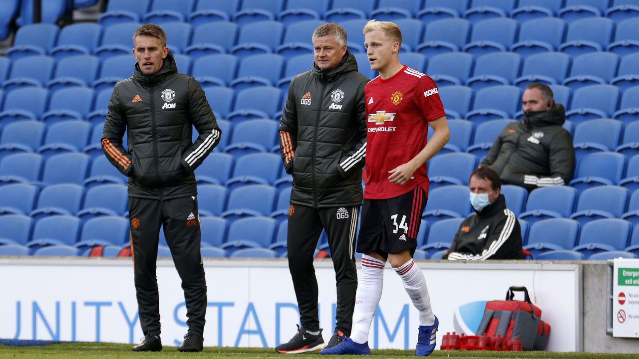 BRIGHTON, ENGLAND - SEPTEMBER 26: Ole Gunnar Solskjaer, Manager of Manchester United speaks with Donny Van De Beek of Manchester United as he prepares to be substituted on during the Premier League match between Brighton & Hove Albion and Manchester United at American Express Community Stadium on September 26, 2020 in Brighton, England. Sporting stadiums around the UK remain under strict restrictions due to the Coronavirus Pandemic as Government social distancing laws prohibit fans inside venues resulting in games being played behind closed doors.