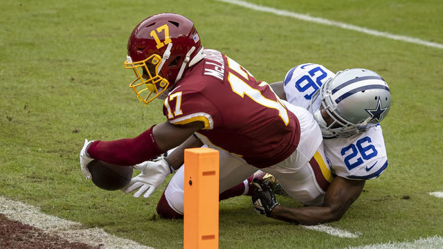 LANDOVER, MD - OCTOBER 25: Terry McLaurin #17 of the Washington Football Team is tackled by Jourdan Lewis #26 of the Dallas Cowboys just short of the endzone during the first half at FedExField on October 25, 2020 in Landover, Maryland.