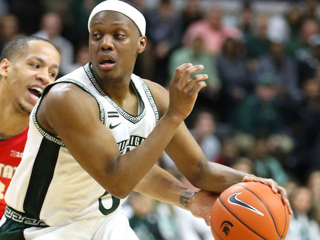 EAST LANSING, MICHIGAN - MARCH 08: Cassius Winston #5 of the Michigan State Spartans drives past CJ Walker #13 of the Ohio State Buckeyes during the first half at the Breslin Center on March 08, 2020 in East Lansing, Michigan.