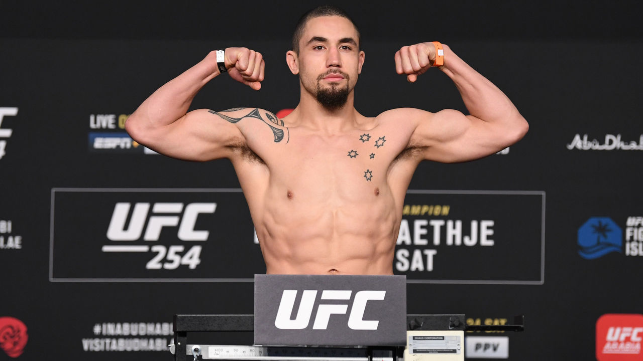 ABU DHABI, UNITED ARAB EMIRATES - OCTOBER 23: In this handout image provided by UFC, Robert Whittaker of Australia poses on the scale during the UFC 254 weigh-in on October 23, 2020 on UFC Fight Island, Abu Dhabi, United Arab Emirates.