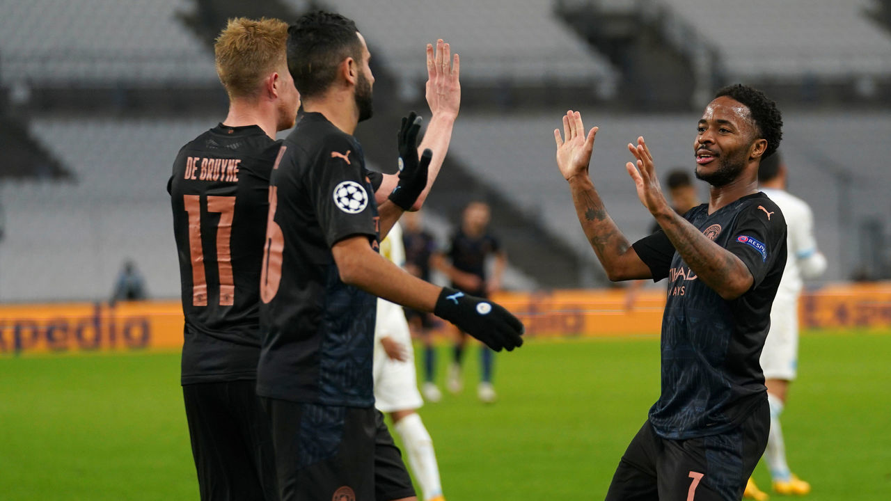MARSEILLE, FRANCE - OCTOBER 27: Raheem Sterling of Manchester City celebrates after he scores his team's third goal during the UEFA Champions League Group C stage match between Olympique de Marseille and Manchester City at Stade Velodrome on October 27, 2020 in Marseille, France. Football Stadiums around Europe remain empty due to the Coronavirus Pandemic as Government social distancing laws prohibit fans inside venues resulting in fixtures being played behind closed doors.