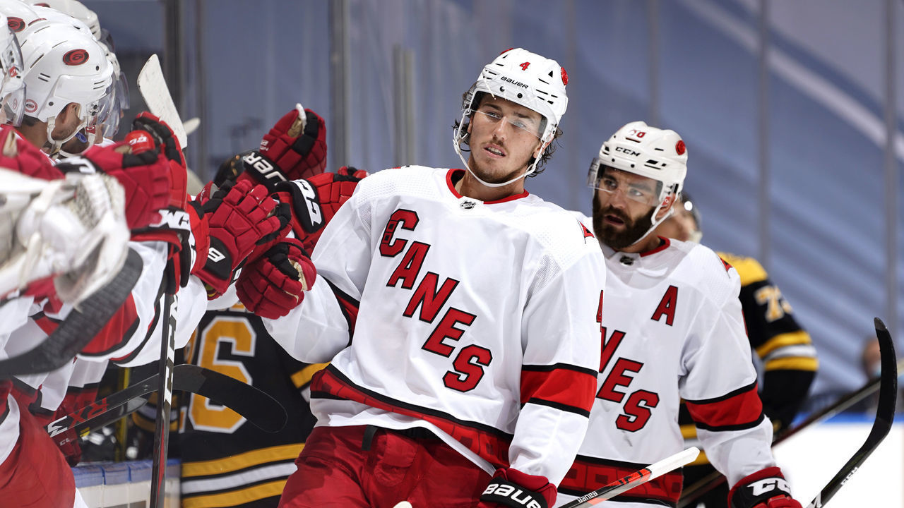 TORONTO, ONTARIO - AUGUST 19: Haydn Fleury #4 of the Carolina Hurricanes celebrates his first period goal against the Boston Bruins with teammates during Game Five of the Eastern Conference First Round during the 2020 NHL Stanley Cup Playoffs at Scotiabank Arena on August 19, 2020 in Toronto, Ontario.