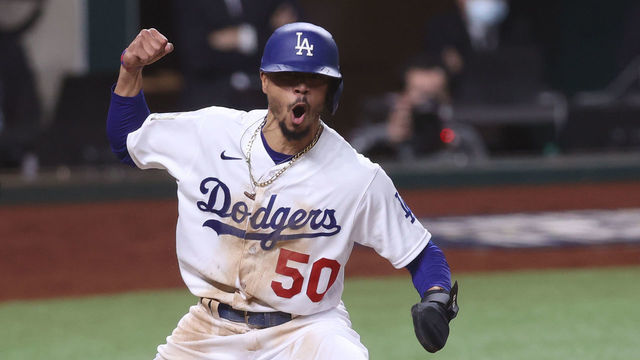 ARLINGTON, TEXAS - OCTOBER 27: Mookie Betts #50 of the Los Angeles Dodgers celebrates after scoring a run against the Tampa Bay Rays during the sixth inning in Game Six of the 2020 MLB World Series at Globe Life Field on October 27, 2020 in Arlington, Texas.