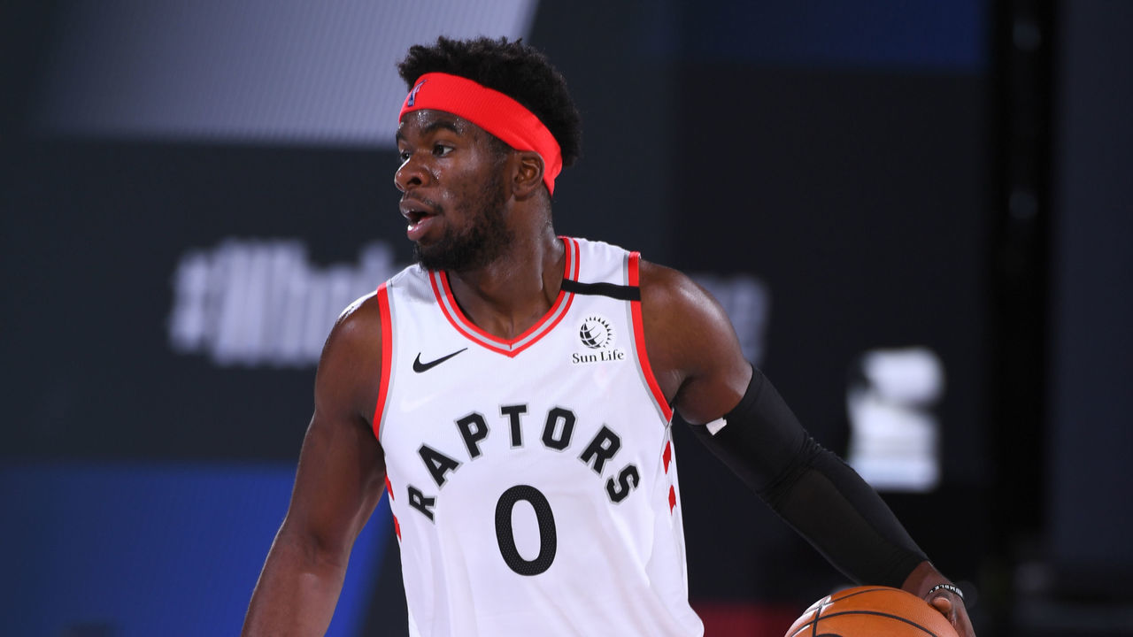Orlando, FL - AUGUST 14: Terence Davis #0 of the Toronto Raptors handles the ball against the Denver Nuggets on August 14, 2020 at The Field House in Orlando, Florida. NOTE TO USER: User expressly acknowledges and agrees that, by downloading and/or using this Photograph, user is consenting to the terms and conditions of the Getty Images License Agreement. Mandatory Copyright Notice: Copyright 2020 NBAE