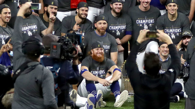 ARLINGTON, TEXAS - OCTOBER 27: Justin Turner #10 and the Los Angeles Dodgers pose for a photo after defeating the Tampa Bay Rays 3-1 in Game Six to win the 2020 MLB World Series at Globe Life Field on October 27, 2020 in Arlington, Texas.
