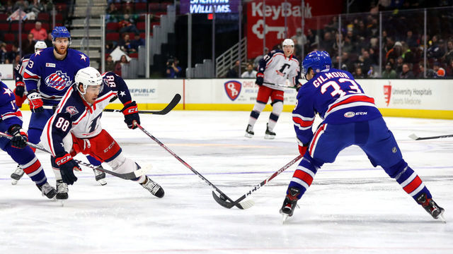 CLEVELAND, OH - JANUARY 22: Rochester Americans defenceman John Gilmour (33) steals the puck from Cleveland Monsters right wing Kole Sherwood (88) during the second period of the American Hockey League game between the Rochester Americans and Cleveland Monsters on January 22, 2020, at Rocket Mortgage FieldHouse in Cleveland, OH.