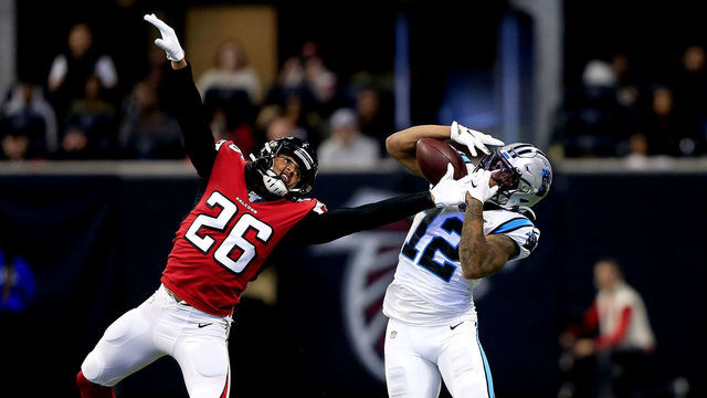 ATLANTA, GA - DECEMBER 08: D.J. Moore (12) of the Carolina Panthers pulls in a pass over Isaiah Oliver (26) of the Atlanta Falcons during the regular season NFL game between the Atlanta Falcons and the Carolina Panthers on December 08, 2019 at the Mercedes-Benz Stadium in Atlanta, GA.